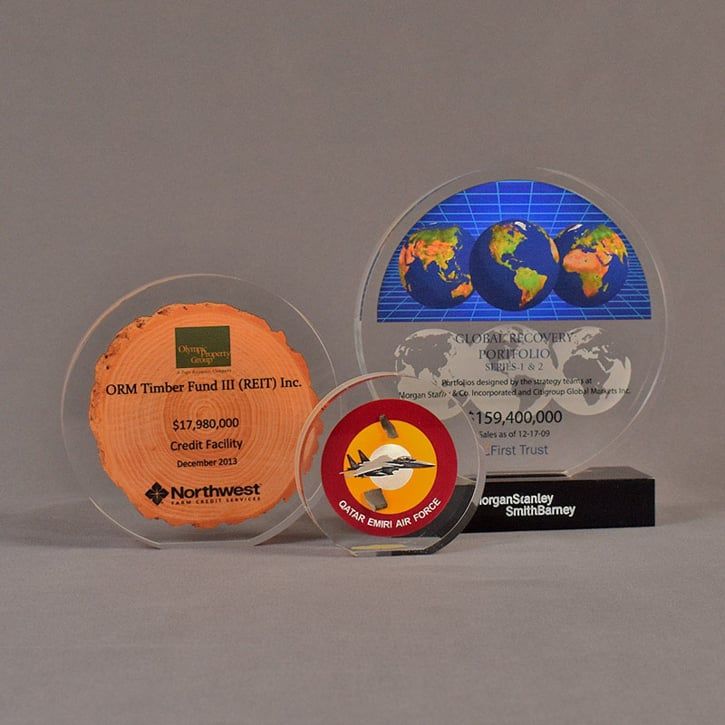 Three acrylic circle embedment awards with full color printed castings.